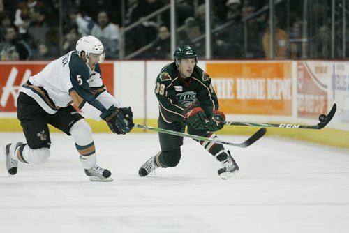 December 17, 2010 - 101217  - Manitoba Moose Nolan Baumgartner (5) tries to stop Houston Aeros Brandon Buck (39) clearing the puck from his zone in the third period of their AHL game in Winnipeg on Friday, December 17, 2010.  John Woods / Winnipeg Free Press