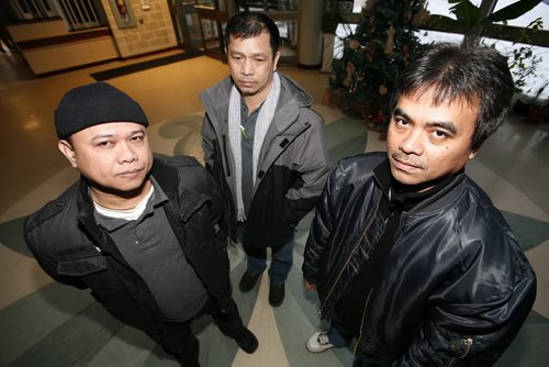 December 18, 2010 - 101218  -  (L to R) Arnisito Gaviola, Ernie Zotomayor, and Antonio Maroya, migrant workers attend a vigil in their honour at the Philippine Canadian Centre of Manitoba in Winnipeg on Saturday, December 18, 2010.  John Woods / Winnipeg Free Press
