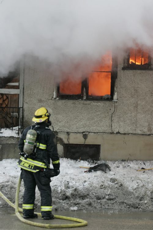 December 19, 2010 - 101219  -  A firefighter watches as a house burns at the corner of McMillan and Stafford in Winnipeg Sunday, December 19, 2010.  John Woods / Winnipeg Free Press