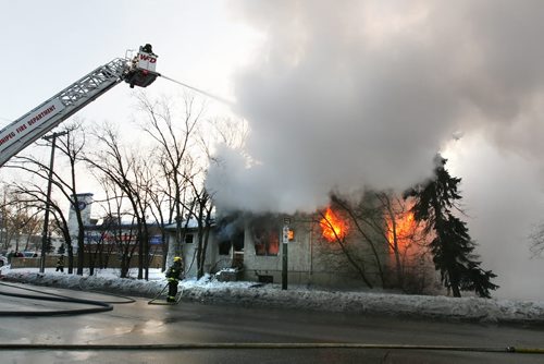 December 19, 2010 - 101219  -  Firefighters fight a house fire at the corner of McMillan and Stafford in Winnipeg Sunday, December 19, 2010.  John Woods / Winnipeg Free Press