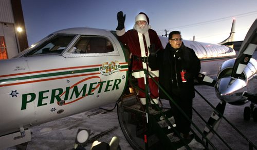 WAYNE.GLOWACKI@FREEPRESS.MB.CA Santa decided to give his reindeer the day off so he checked in at Perimeter Aviation early Monday morning on the MKO Santa flight with Grand Chief David Harper  to visit and deliver gifts to  children in northern communities   Margo Goodhand story    Winnipeg Free Press Dec. 20 2010