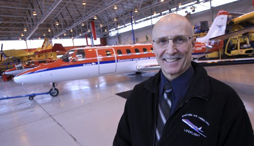 MIKE.DEAL@FREEPRESS.MB.CA 101222 - Wednesday, December 22, 2010 - Rick Sellwood, Chief Flight Nurse, with Lifeflight Air Ambulance and the Cessna Citation 560 Air Ambulance in the hangar at 900 Ferry Road. See Jen Skerritt story MIKE DEAL / WINNIPEG FREE PRESS