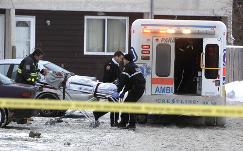 MIKE.DEAL@FREEPRESS.MB.CA 101222 - Wednesday, December 22, 2010 - A victim of a stabbing in the 1000 block of Selkirk Avenue is loaded onto an ambulance just after 8:30 a.m. and taken to hospital in critical condition. He has since been updated to stable condition. MIKE DEAL / WINNIPEG FREE PRESS