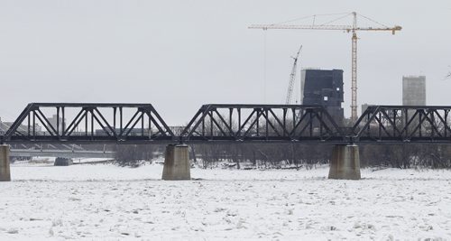 TREVOR HAGAN / WINNIPEG FREE PRESS - Frazil ice on the Red River near The Alexander Docks. The construction site of the Museum for Human Rights can be seen in the background. 10-12-23 CMHR