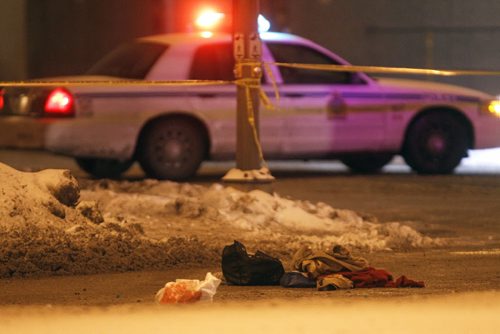 TREVOR HAGAN / WINNIPEG FREE PRESS - A persons belongings lay on McPhillips Street near Pacific Avenue. Police had McPhillips closed from William to Pacific after a pedestrian was struck by a vehicle. 10-12-23