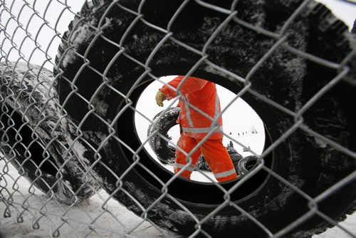 December 29, 2010 - 101229  -   Winnipeg city crews build a fence and install tires to help protect sledders at Garbage Hill on Wednesday, December 29, 2010. John Woods / Winnipeg Free Press