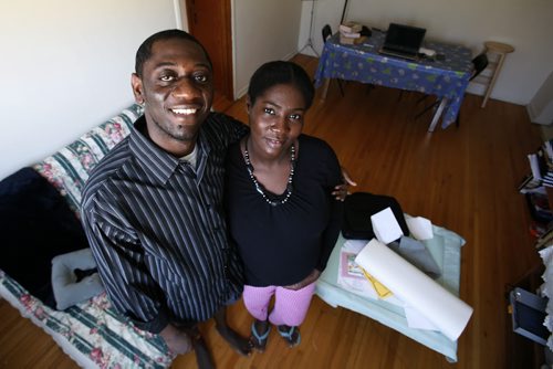 January 1, 2011 - 110101  - Haitian Arisnel (L) and Syvelie Mesidor smile as they pose for a photograph in their Winnipeg apartment on Saturday, January 1, 2011. Arisnel Mesidor brought his wife to Canada last year after the earthquake. Syvelie is one of 15,000 newcomers who came to Manitoba in 2010 - a new record. John Woods / Winnipeg Free Press