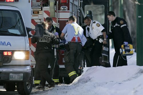 January 4, 2011 - 110104  - Emergency personnel remove an infant in critical condition from 514 Boyd Tuesday afternoon, January 4, 2011.  John Woods / Winnipeg Free Press