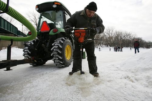 January 4, 2011 - 110104  - Virgil Bastien digs a hole in the ice in preparation of flooding a rink at The Forks Tuesday, January 4, 2011.  John Woods / Winnipeg Free Press