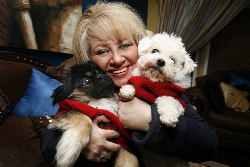 January 06, 2011 - 110106  - Barbara Camara cuddles with Chuckie (L) and Bella, two of her six dogs, in her Winnipeg home Thursday, January 06, 2011.    John Woods / Winnipeg Free Press