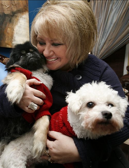 January 06, 2011 - 110106  - Barbara Camara cuddles with Chuckie (L) and Bella, two of her six dogs, in her Winnipeg home Thursday, January 06, 2011.    John Woods / Winnipeg Free Press