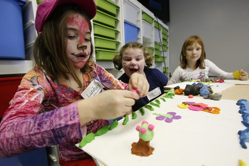 January 08, 2011 - 110108  -  Eight year old McKenzie Laplante (M) and Aime Halldorsson (R) react to Lindsay Dyck's pink apples as she creates her masterpiece at the grand opening of Art Land Studio on Henderson Saturday, January 8, 2011. Art Land Studio is Winnipeg's only art studio for children and is supporting the Children's Wish Foundation by donating a portion of their annual proceeds to the organisation. John Woods / Winnipeg Free Press