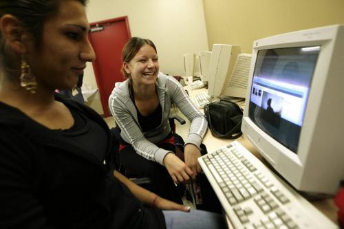 John Woods / Winnipeg Free Press / October 5, 2006 - 061005 - Shayne Keesic (L) and Delima Chiarella use the resources at the Ka Ni Kanichihk community training and resource centre grand opening event Thursday, Oct. 5/06.