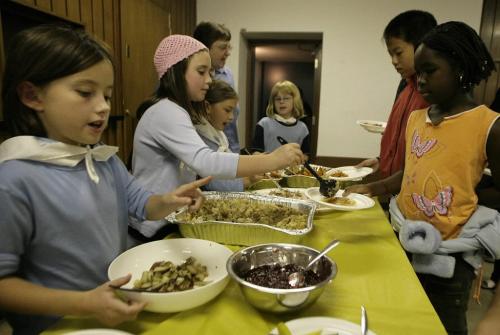 John Woods / Winnipeg Free Press / October 5, 2006 - 061005 Girl Guides help serve a Thanksgiving dinner put on for immigrants at the International Centre Thursday, Oct. 5/06.  The Girl Guides helped with fund raising and serving of the meal.