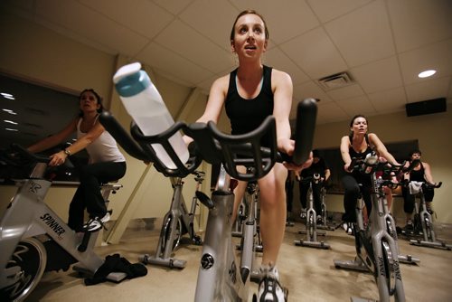 January 14, 2011 - 110113  -  On Friday, January 14, 2011 at Goodlife Fitness Anna Choy (C) and Breanne Stashko (R) take part in a RPM session. John Woods / Winnipeg Free Press