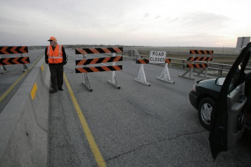 John Woods / Winnipeg Free Press / October 6, 2006 - 061006 - Prov. highway worker mans the  the Trans canada overpass just east of Portage.  RCMP diverted traffic into Portage after they closed the Trans Canada overpass Friday Oct 6/06.  It is reported the bridge was closed because it is unsafe.