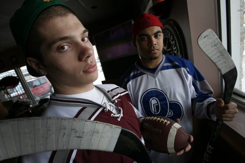 Winnipeg - January 18, 2011 - DJ Lalama (L) of St Paul's Crusaders high school football team and Nic Demski of Oak Park Raiders high school football team pose for a photograph at Cosmos Restaurant Tuesday, January 18, 2011. The players have been named to the Winnipeg High School Hockey League's first division all-star team for the all-star game on Saturday.  (John Woods/Winnipeg Free Press)
