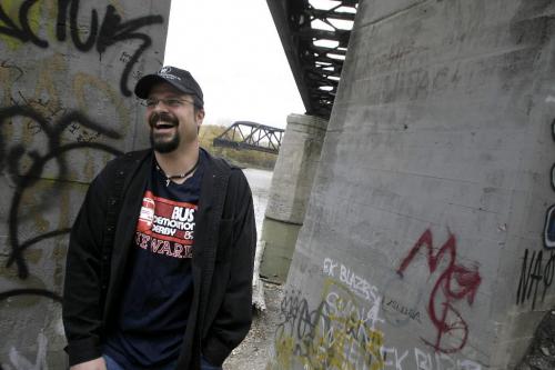 John Woods / Winnipeg Free Press / October 7, 2006 - 061007 - Kevin Doherty is the director of Black Bridge a low-budget feature about a group of headbangers (circa 1984) who get implicated in a murder.  Doherty is photographed beside the abandoned railway bridge on the Red River that the story is based on Saturday Oct 7/06.