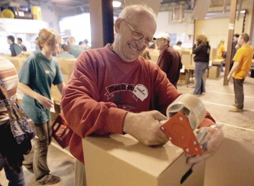 John Woods / Winnipeg Free Press / October 7, 2006 - 061007 - Ron O'Donovan, makes boxes at the annual Share Your Thanksgiving at Winnipeg Harvest Saturday Oct 7/06. O'Donovan has been volunteering at Harvest for twenty years.