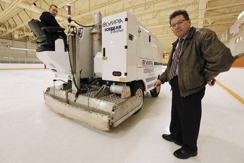 January 25, 2011 - 110125  -  Russell Britton (R), director of facilities at St. Johns Ravenscourt School and Kevin Landry, arena operations coordinator, pose for photographs with their new laser guided ice making machine Tuesday, January 25, 2011.    John Woods / Winnipeg Free Press