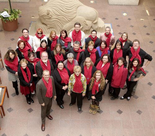 MIKE.DEAL@FREEPRESS.MB.CA 110127 Employees at the Winnipeg Free Press wear their Ladybug scarves with Ladybug girl, Hannah Taylor (front right).  Mike Deal / Winnipeg Free Press