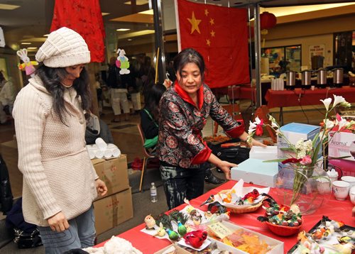 Brandon Sun Volunteers help set up the Chinese pavilion, as part of the Global Village site in the Lieutenant-Governor's Winter Festival in the Town Centre. (Colin Corneau/Brandon Sun)
