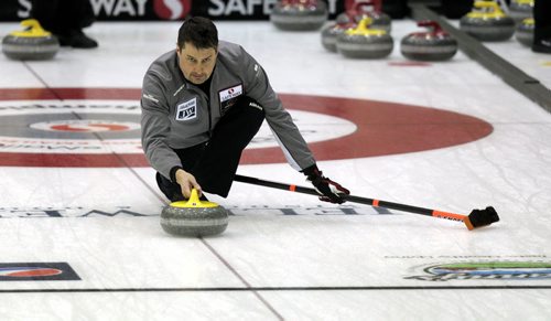 MIKE.DEAL@FREEPRESS.MB.CA 110208 - Tuesday, February 08, 2011 - Competitors in the Safeway Championship curling bonspiel in Beausejour, Manitoba practice on Tuesday, February 8, 2011. Skip Garth Smith throws a rock during practice. See Paul Wiecek story.  MIKE DEAL / WINNIPEG FREE PRESS