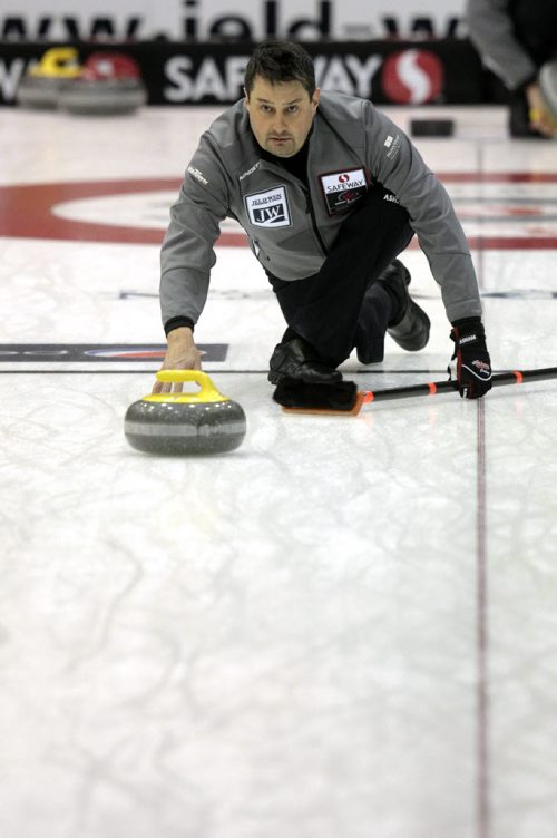MIKE.DEAL@FREEPRESS.MB.CA 110208 - Tuesday, February 08, 2011 - Competitors in the Safeway Championship curling bonspiel in Beausejour, Manitoba practice on Tuesday, February 8, 2011. Skip Garth Smith throws a rock during practice. See Paul Wiecek story. MIKE DEAL / WINNIPEG FREE PRESS
