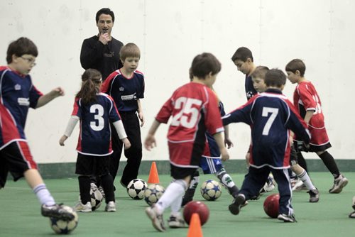 MIKE.DEAL@FREEPRESS.MB.CA 110208 - Tuesday, February 08, 2011 - Fabio Capone with Headstart Soccer and some kids in his program at Cover-all Sports in Headingley. See Malissa Martin story. MIKE DEAL / WINNIPEG FREE PRESS