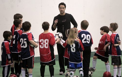 MIKE.DEAL@FREEPRESS.MB.CA 110208 - Tuesday, February 08, 2011 - Fabio Capone with Headstart Soccer and some kids in his program at Cover-all Sports in Headingley. See Malissa Martin story. MIKE DEAL / WINNIPEG FREE PRESS