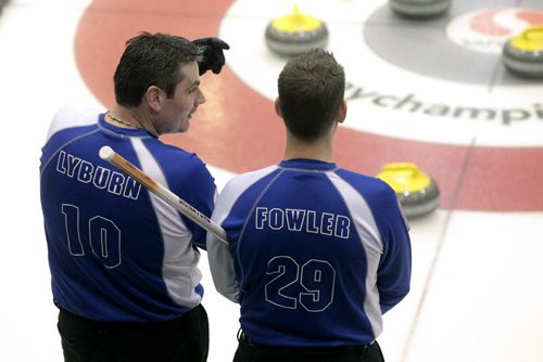MIKE.DEAL@FREEPRESS.MB.CA 110209 - Wednesday, February 09, 2011 - Skip Rob Fowler (right) and Third Allan Lyburn from the Brandon Curling Club talk between rocks during the 12:15 draw on the first day of the Safeway Championship in Beausejour, Manitoba. See Paul Wiecek story. MIKE DEAL / WINNIPEG FREE PRESS