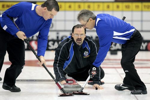 MIKE.DEAL@FREEPRESS.MB.CA 110209 - Wednesday, February 09, 2011 - Skip Dave Boehmer from Petersfield during the 12:15 draw on the first day of the Safeway Championship in Beausejour, Manitoba. See Paul Wiecek story. MIKE DEAL / WINNIPEG FREE PRESS