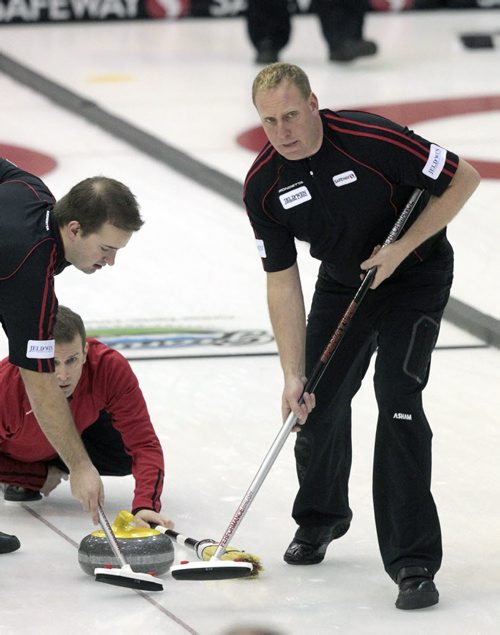MIKE.DEAL@FREEPRESS.MB.CA 110210 - Thursday, February 10, 2011 - Competitors during the 12:15 draw on the second day of the Safeway Championship in Beausejour, Manitoba. Team Stoughtons' Lead Steve Gould sweeps during a throw by Jeff Stoughton. See Paul Wiecek story. MIKE DEAL / WINNIPEG FREE PRESS