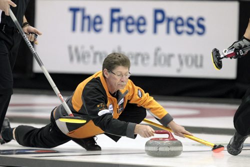 MIKE.DEAL@FREEPRESS.MB.CA 110210 - Thursday, February 10, 2011 - Competitors during the 12:15 draw on the first day of the Safeway Championship in Beausejour, Manitoba. Skip Brent Strachan throws a rock. See Paul Wiecek story. MIKE DEAL / WINNIPEG FREE PRESS
