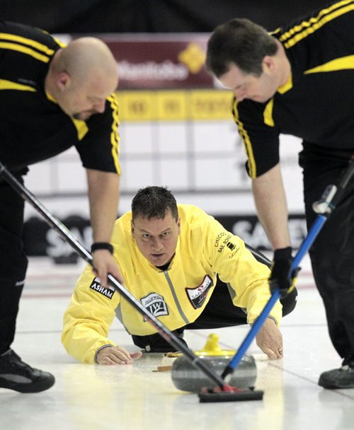 MIKE.DEAL@FREEPRESS.MB.CA 110210 - Thursday, February 10, 2011 - Competitors during the 12:15 draw on the first day of the Safeway Championship in Beausejour, Manitoba. Skip Dave Elias throws a rock. See Paul Wiecek story. MIKE DEAL / WINNIPEG FREE PRESS