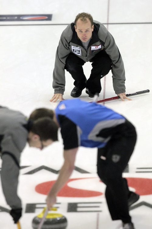 MIKE.DEAL@FREEPRESS.MB.CA 110210 - Thursday, February 10, 2011 - Competitors during the 12:15 draw on the first day of the Safeway Championship in Beausejour, Manitoba. Skip Sean Grassie throws a rock. See Paul Wiecek story. MIKE DEAL / WINNIPEG FREE PRESS