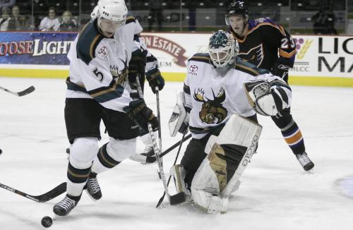 John Woods / Winnipeg Free Press / October 14, 2006 - 061014 - Manitoba Moose goalie Wade Flaherty  (33) comes way out of the crease to help Nick Kuiper (5) defend the net against the Philadelphia Phantoms in first period AHL action in Winnipeg Saturday, Oct 14/06.