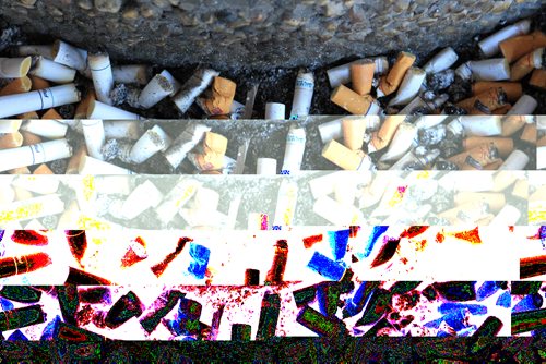 JOE.BRYKSA@FREEPRESS.MB.CA Local- ( For file)-Cigarette butts over flow from a outside ashtray in front of a downtown Winnipeg hotel - JOE BRYKSA/WINNIPEG FREE PRESS- Feb 15, 2010