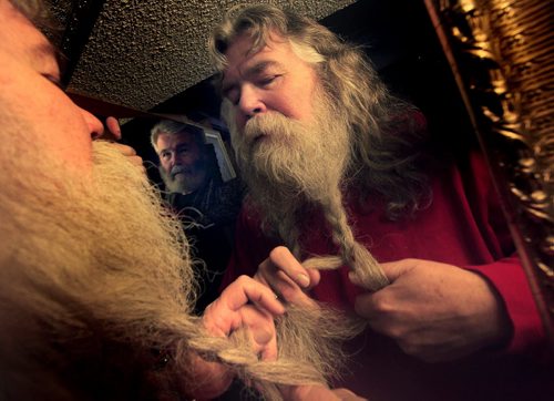 PHIL.HOSSACK@FREEPRESS.MB.CA 110225-WINNIPEG FREE PRESS Sean Stacey braids his flowing beard under the watchfull gaze of Master Barber Bryan Roberton Friday,  preparing for the evening's Festival du Voyageur Annual Beard Growing Contest. Stacey's entering the "Novelty" Category in the competition. Other categories ar "Voyageur" and "Clean Shaven.
