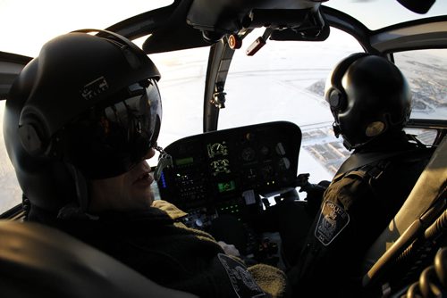 TREVOR HAGAN / WINNIPEG FREE PRESS - Const. Nick Paulet and Pilot, Renee Brindeau fly Air 1, the Winnipeg Police Service  WPS helicopter above the city. 11-02-25