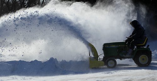 JOE.BRYKSA@FREEPRESS.MB.CALocal- (Standup photo)- Chad  Fetterly operates his snow blower south of Selkirk, Manitoba on Main St on Tuesday- Heavy winds throughout Southern, Manitoba caused white out conditions and forced many  rural schools to close for the day . JOE BRYKSA/WINNIPEG FREE PRESS- Mar 01, 2011