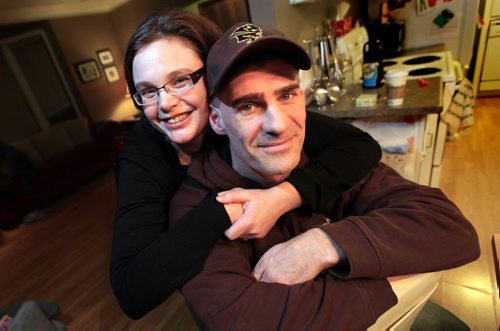 PHIL.HOSSACK@FREEPRESS.MB.CA 110301-Winnipeg Free Press Bison Women's hockey Coach Jon Rempel, and his wife Jennifer pose in their St Boniface home. See Ashely's tale.