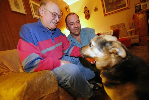 Winnipeg, Manitoba - 110303 - Helmut Herbstreit and his son Glenn are photographed with Glenn's dog Jessy in Mr Herbstreit's house in Winnipeg Thursday, March 3, 2011. Glenn was delivered by two police officers in the middle of the March 4 1966 blizzard after they had their route cleared by a front end loaded. (John Woods/Winnipeg Free Press)