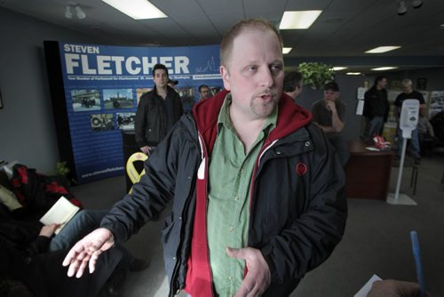 MIKE.DEAL@FREEPRESS.MB.CA 110308 - Tuesday, March 08, 2011 - Dozens of Air Canada maintenance workers upset about the possibility of future job losses have launched a sit-in inside Tory MP Steven Fletcher's local constituency office today. Kevin Polonuk, the vice-president of the International Association of Machinists and Aerospace Workers, Airline Lodge 714, talks to the Free Press as he stands inside Fletcher's office in St. James. See Kevin Rollason story. MIKE DEAL / WINNIPEG FREE PRESS