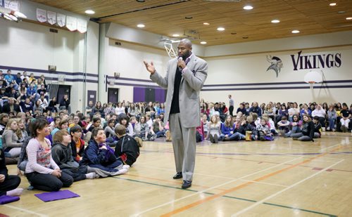 Brandon Sun 09032011 NFL player and Vincent Massey High School alumni Israel Idonije addresses students from his former high school as well as visitors from J.R. Reid, Meadows and Linden Lanes schools in the gymnasium at VMHS on Wednesday afternoon. Idonije took questions from the audience and signed hundreds of autograph's for students in attendance. (Tim Smith/Brandon Sun)