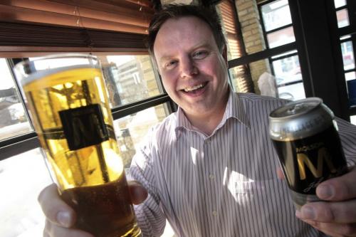 MIKE.DEAL@FREEPRESS.MB.CA 110310 - Thursday, March 10, 2011 - Steve Riley with Three Degrees Celsius holds a Molson M beer that is new to the Manitoba market which has micro-bubbles. see Geoff Kirbyson story MIKE DEAL / WINNIPEG FREE PRESS