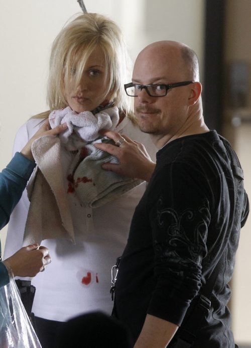 TREVOR HAGAN / WINNIPEG FREE PRESS - Makeup artist, Doug Morrow, right, contains artificial blood on the neck of Samatha Kendrick during filming of Wrong Turn 4. The horror flick is being shot at the former Brandon Mental Health Institute in Brandon, Manitoba. 11-03-07