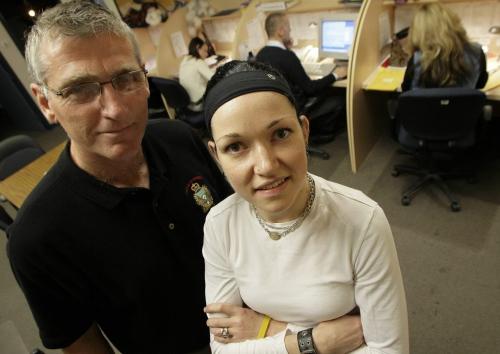 John Woods / Winnipeg Free Press / October 23, 2006 - 061023 - Father and daughter team of Jen and Jim Bell volunteer at the Victim Services Section of the Winnipeg Police.  Jim Bell is a retired police sargeant.  The Bells were photographed in the service centre on Monday Oct 23/06.