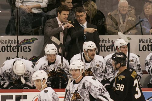 Winnipeg, Manitoba - 110318 -  Manitoba Moose assistant coach  Keith McCambridge (L) talks with head coach Claude Noel on the bench against  the Texas Stars on Friday, March 18, 2011.   (JOHN.WOODS@FREEPRESS.MB.CA)