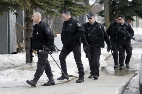 MIKE.DEAL@FREEPRESS.MB.CA 110322 - Tuesday, March 22, 2011 - The Winnipeg Police had an address on Mandalay Drive surrounded following a police involved shooting at another address in the city. A dodge truck was located at the address with a bullet hole in its side and a smashed passenger-side window. MIKE DEAL / WINNIPEG FREE PRESS
